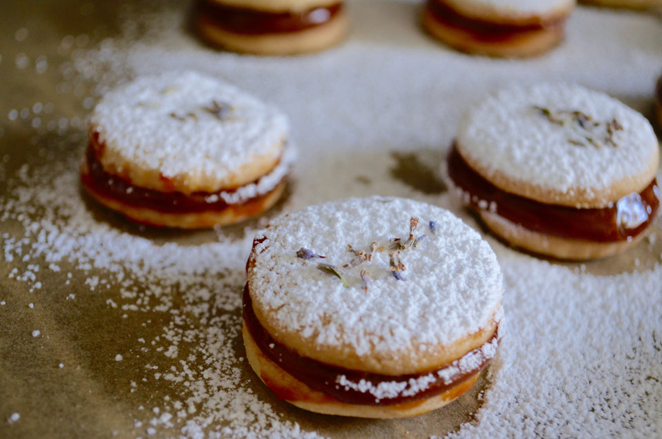 Not your average Alfajor! These lavender infused dulce de leche alfajores will leave you wanting more! Available for shipping or pick up out of new york. custom orders available for special events